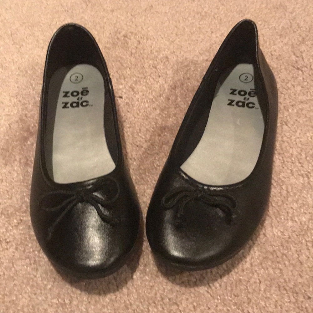 Girl’s black flats, size 2